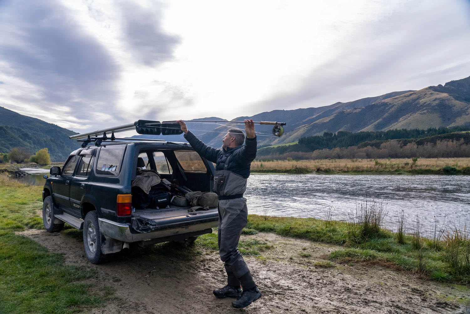 Parked riverside loading a 4-Banger River Quiver with fly rods