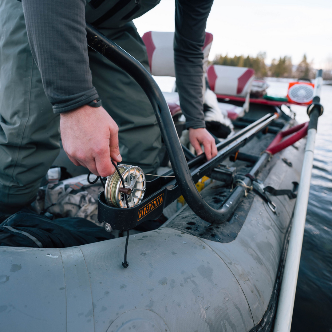 fishing rod in pole holder on boat Stock Photo